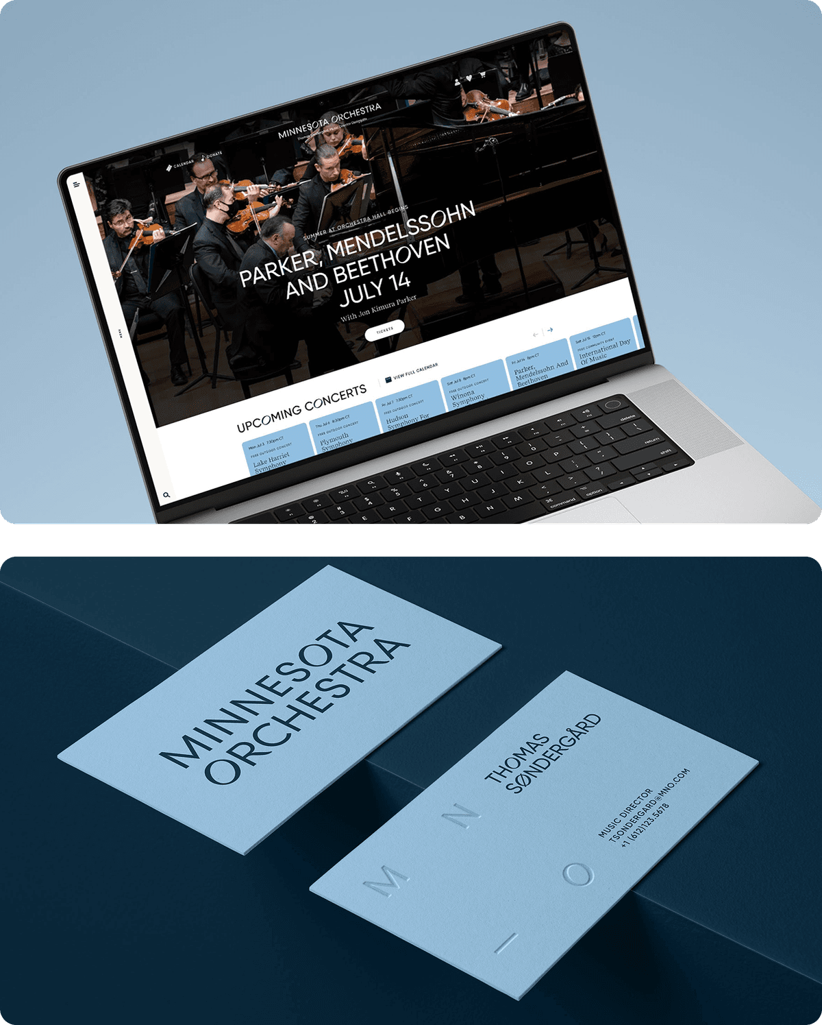 Top image: A laptop screen displaying the Minnesota Orchestra website, featuring a promotional banner for an upcoming concert with Parker, Mendelssohn, and Beethoven on July 14, and a calendar of upcoming concerts below. 

Bottom image: Two minimalist light blue business cards for Minnesota Orchestra on a dark blue surface. One card shows the orchestra name in bold letters, the other shows the name "Thomas Søndergård," his title as Music Director, email, and phone number, with subtle embossed letters spelling "M N O."
