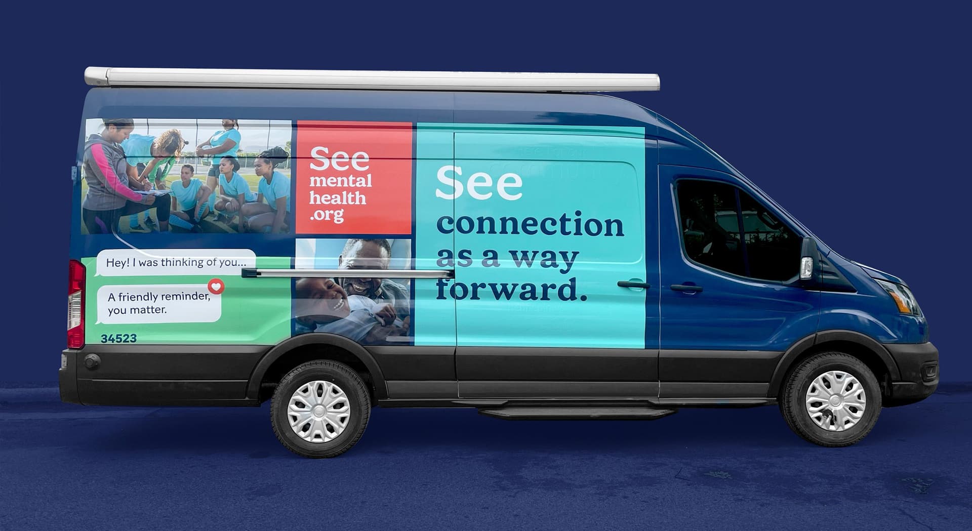Side view of a blue van with mental health awareness graphics including a group of people in a supportive sports setting, text message bubbles saying "Hey! I was thinking of you..." and "A friendly reminder, you matter.", and slogans "See mentalhealth.org" and "See connection as a way forward."
